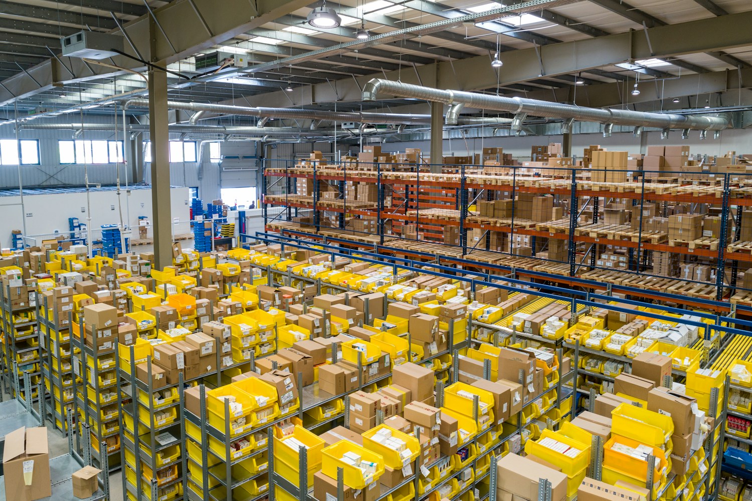 Organized logistics center with racks, inventory, and pallets