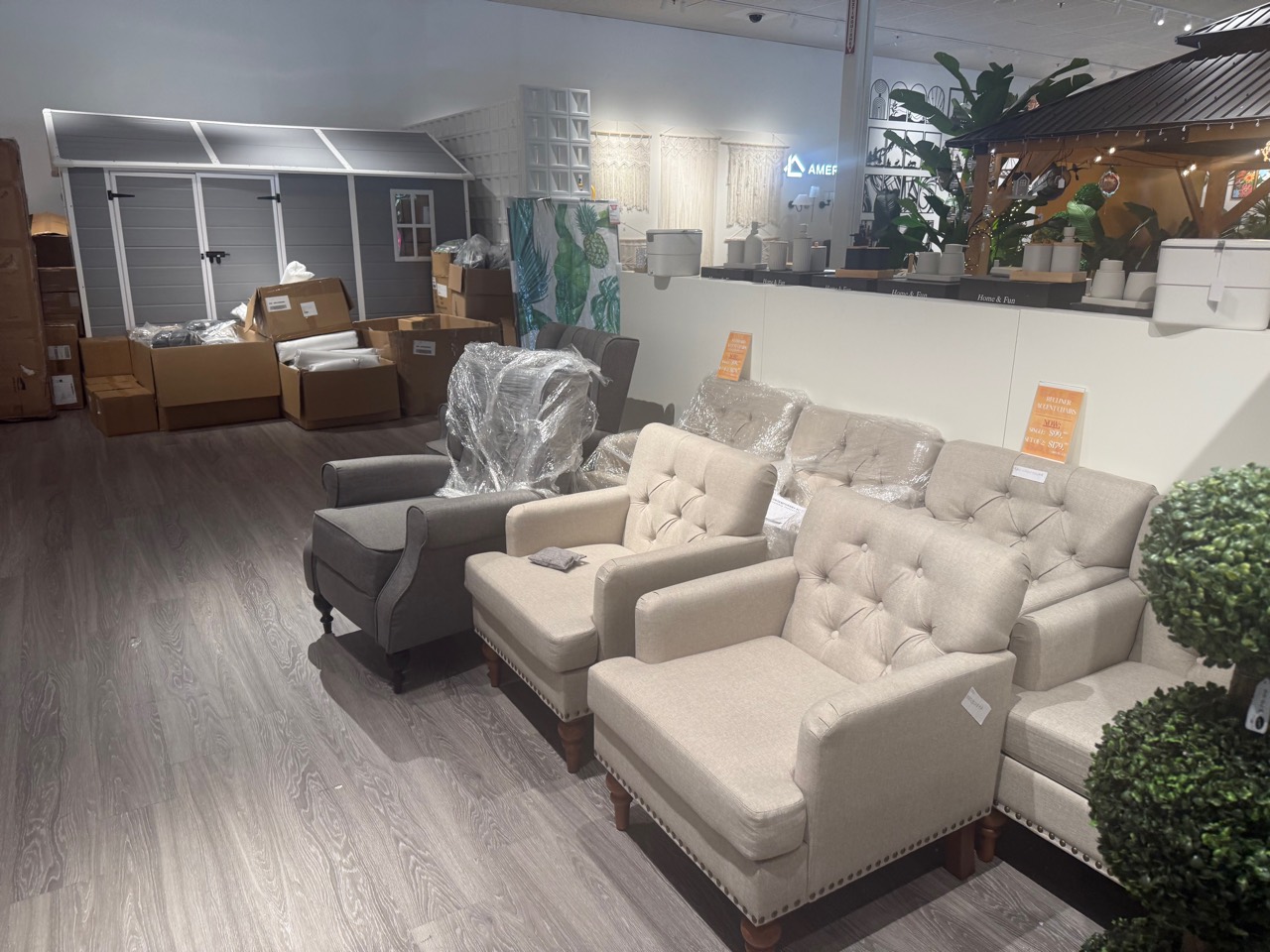 Upholstered lounge chairs prepared for retail presentation