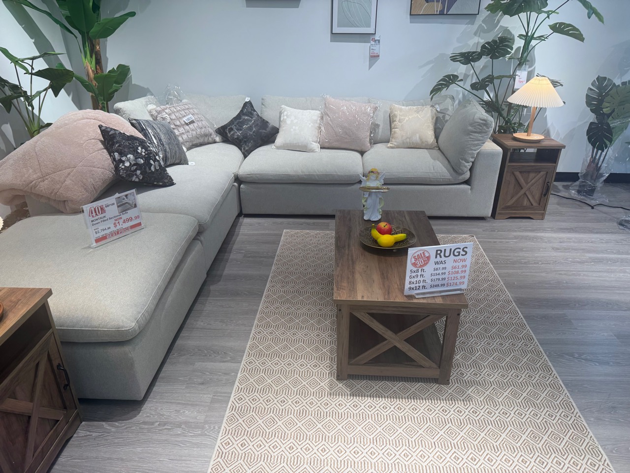 Coordinated sectional, rug, coffee table, pillows, and lighting