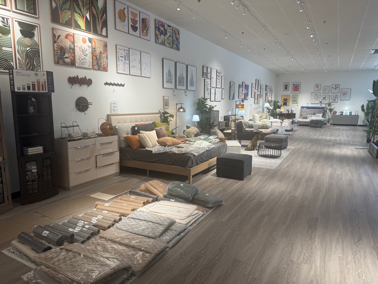 Eminent Home Living showroom with complete bedroom and living room displays